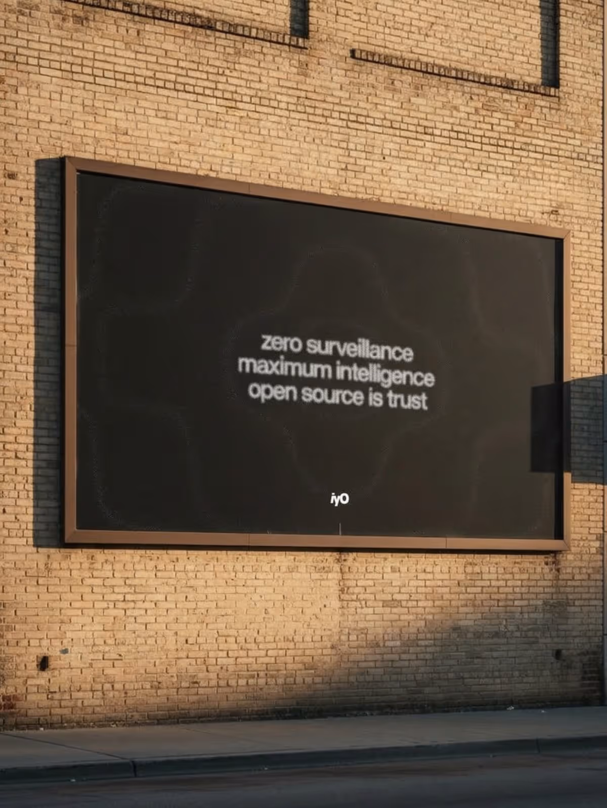 Billboard on brick wall reads: zero surveillance maximum intelligence open source is trust.