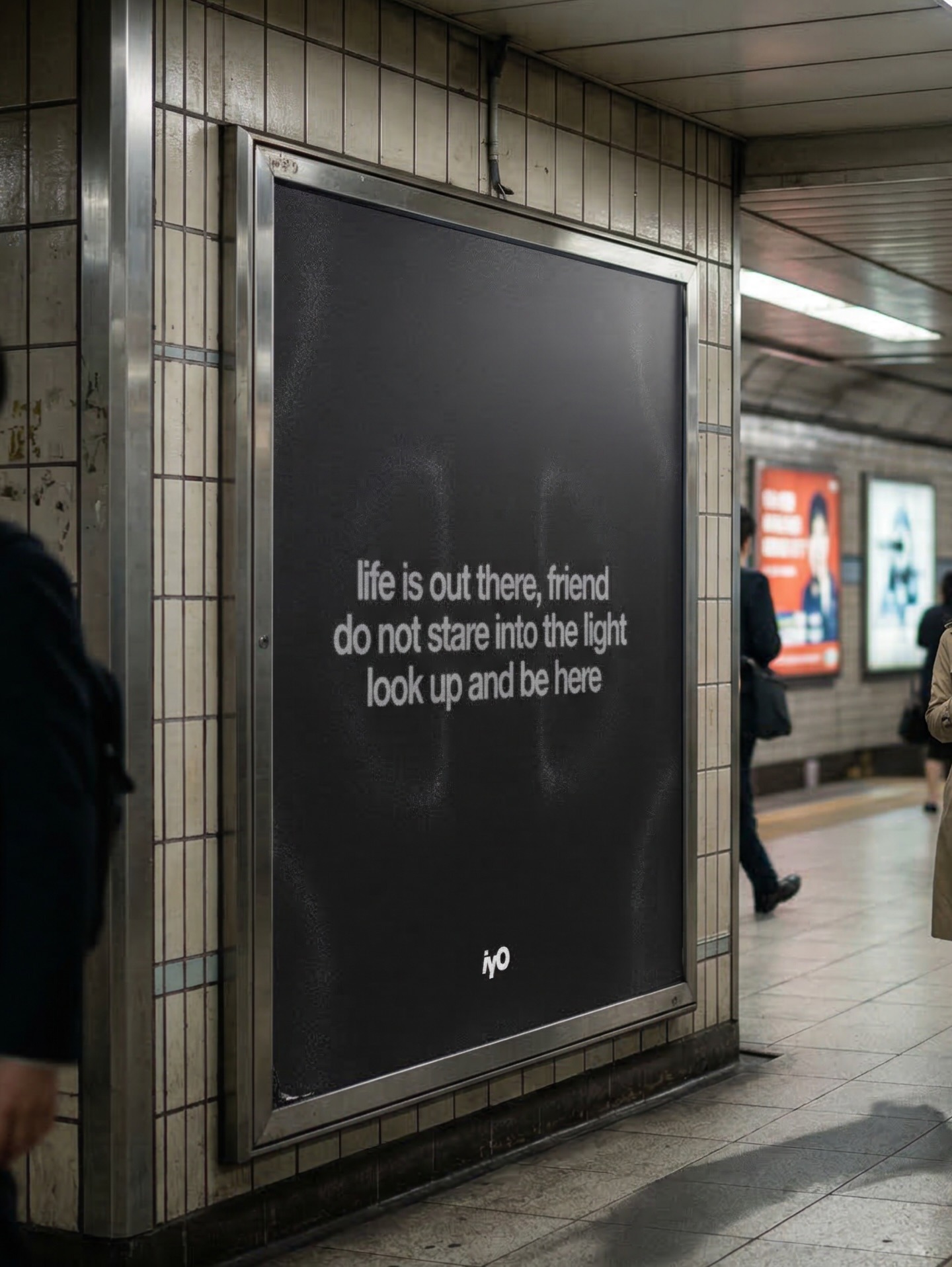 Black subway poster with white text: life is out there, friend, do not stare into light, look up and be here.